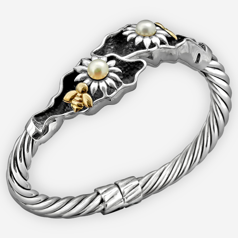 Gold bee silver bangle with flower motifs set with pearls and 14k gold bees.