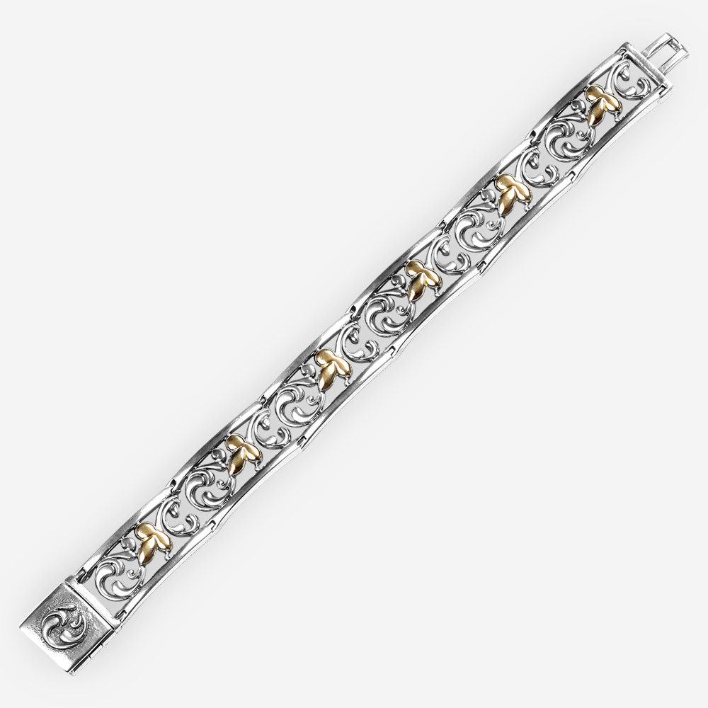 Two tone delicate silver bracelet with 14k gold leaves design and filigree background.