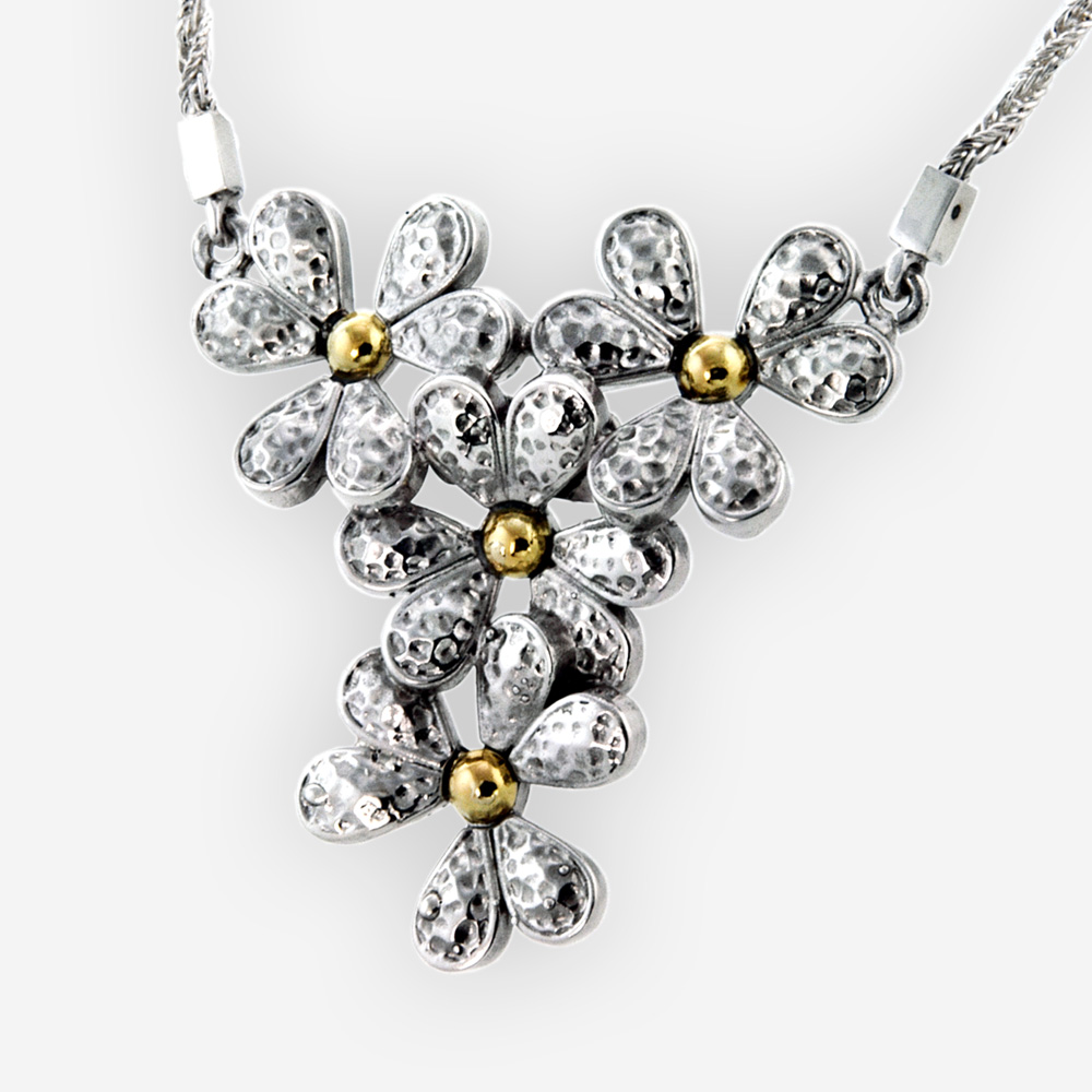 Hammered silver flower necklace is carfted from 925 sterling silver with 14k gold pistils.