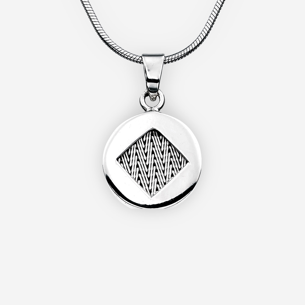 Handwoven silver herringbone pendant with high polished finish.