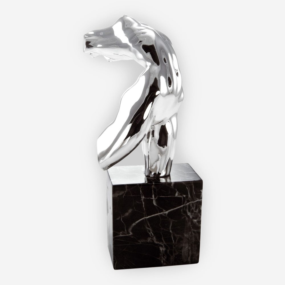 Lady's torso silver sculpture is crafted with electroforming techniques and dipped in sterling silver.
