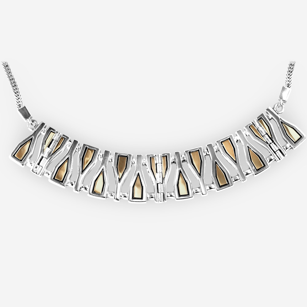 Large silver geometric fragments collar necklace crafted from 925 sterling silver and 14k gold on a silver chain.