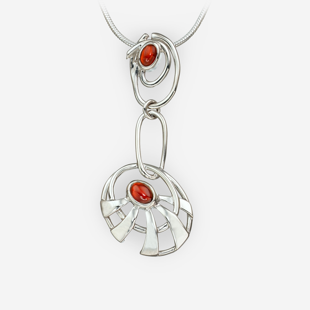 Long abstract sun silver pendant featuring garnet gemstone cabochons.