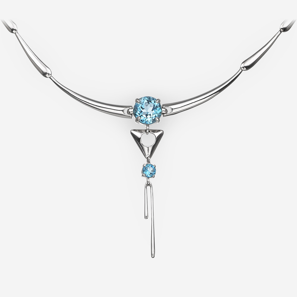 Long sterling silver blue topaz necklace with high polished finish.