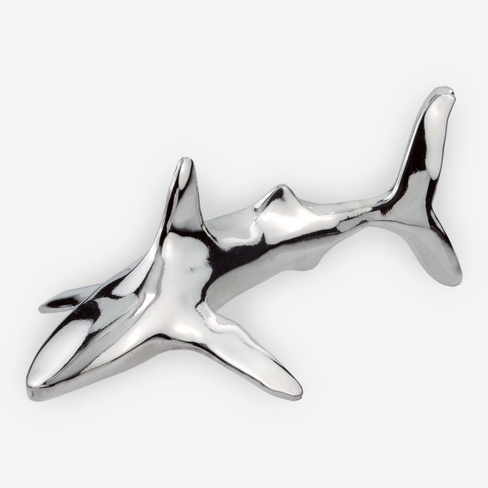 Minimalist silver shark sculpture is crafted with electroforming techniques and dipped in sterling silver.