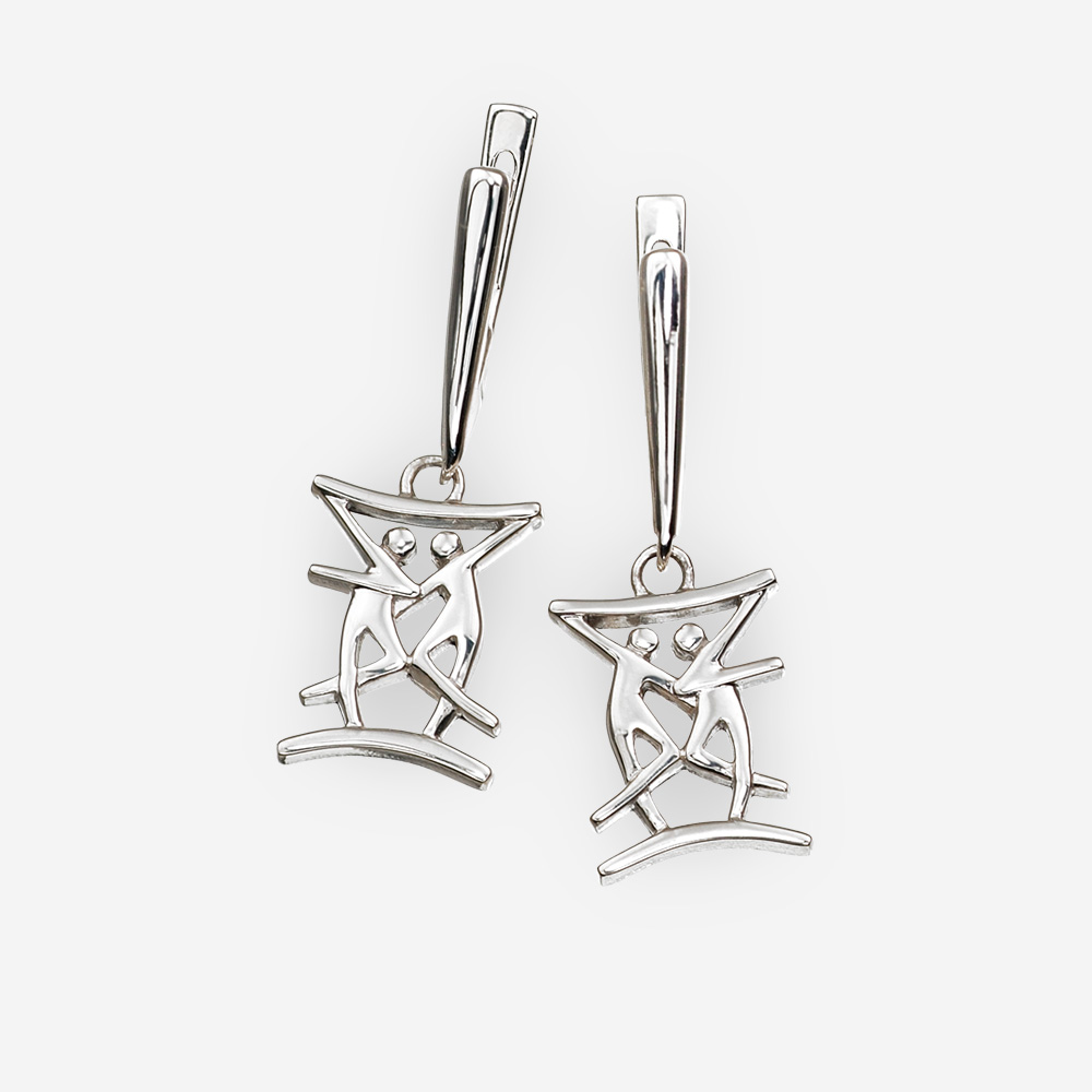 Modern silver dangle earrings with dancing couple design and latch back closures.