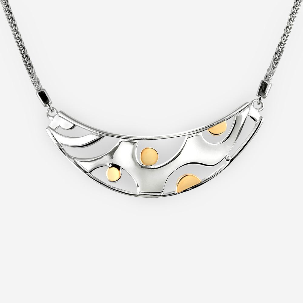 Modern silver statement necklace crafted from 925 sterling silver and with 14k gold dots.
