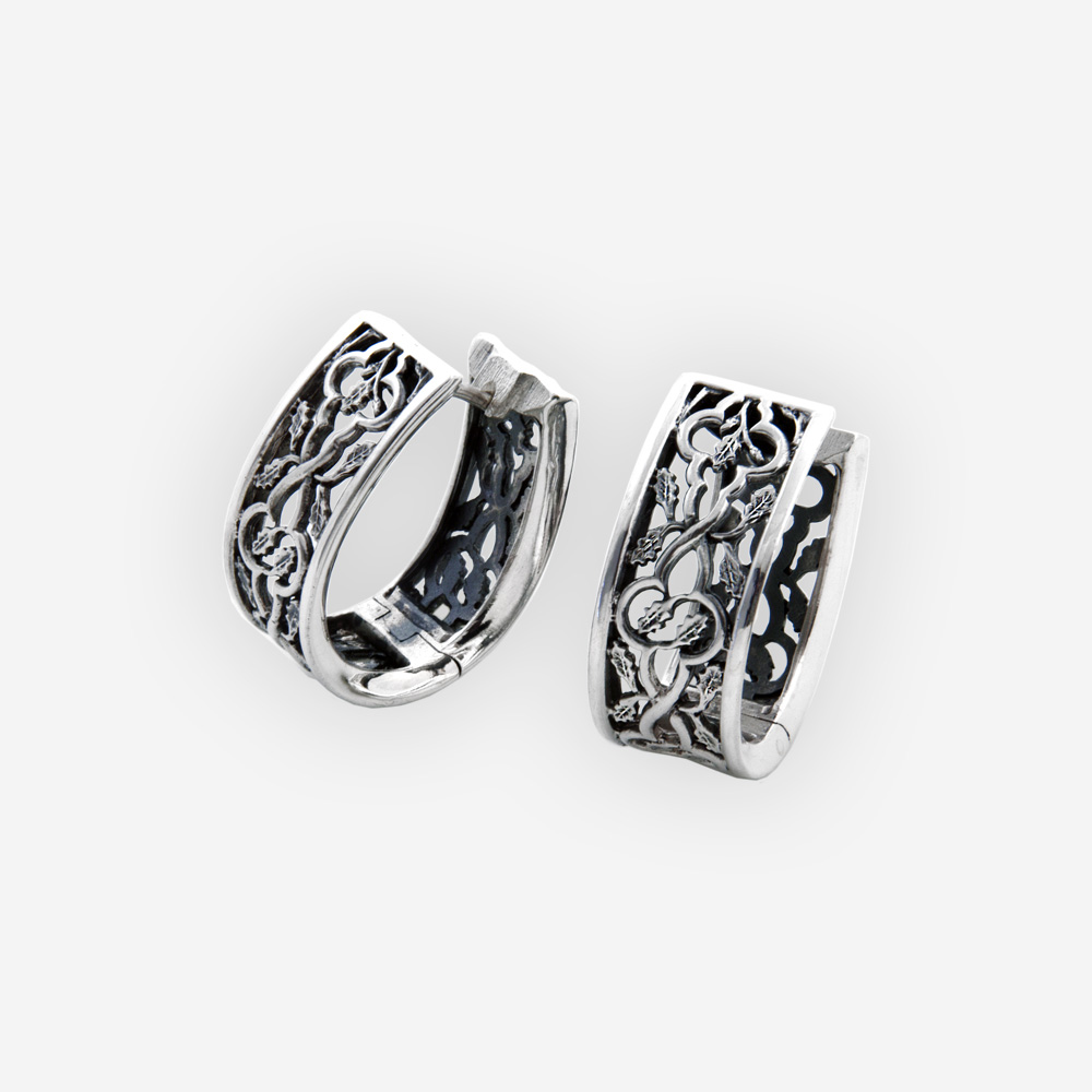 Scrolling leaves silver openwork hoops feature openwork scrolling leaves design, huggie closure, and crafted in 925 sterling silver.