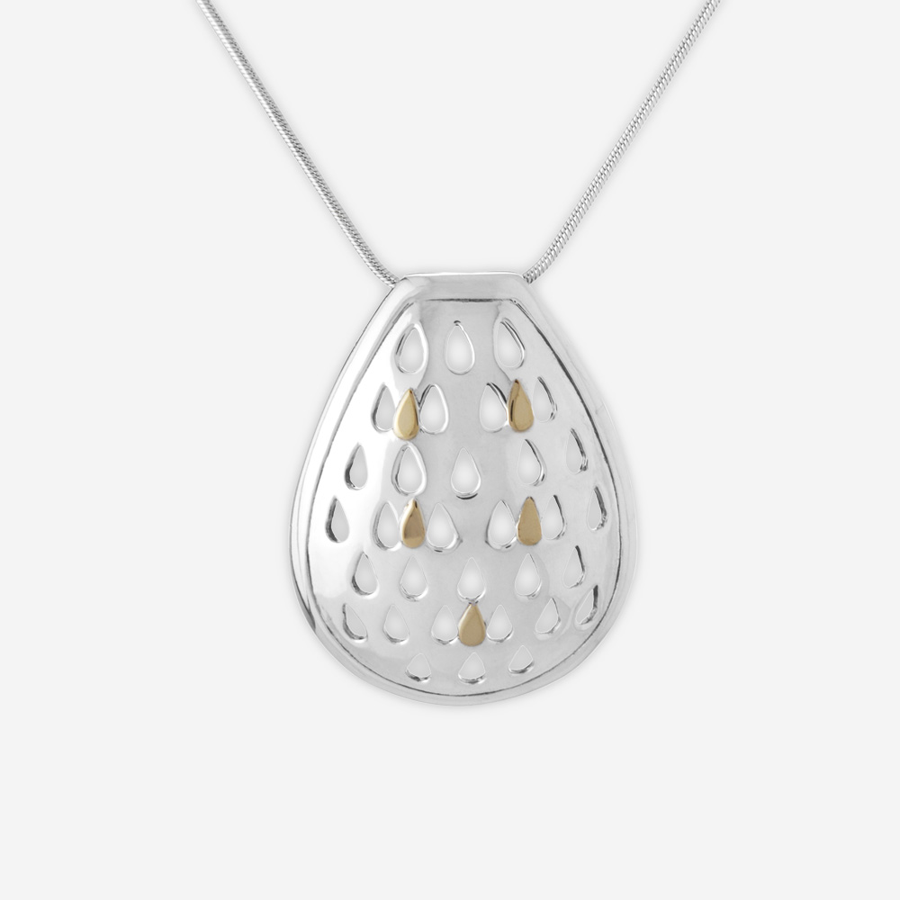 Silver cutout teardrop necklace crafted from 925 sterling silver with 14k gold teardrop accents.