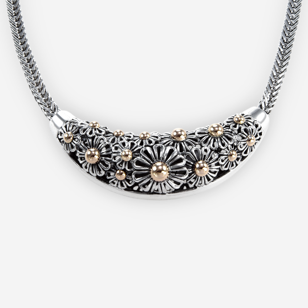 The Silver and Gold Daisies Necklace, in sterling silver with gold centered daisies and franco chain.