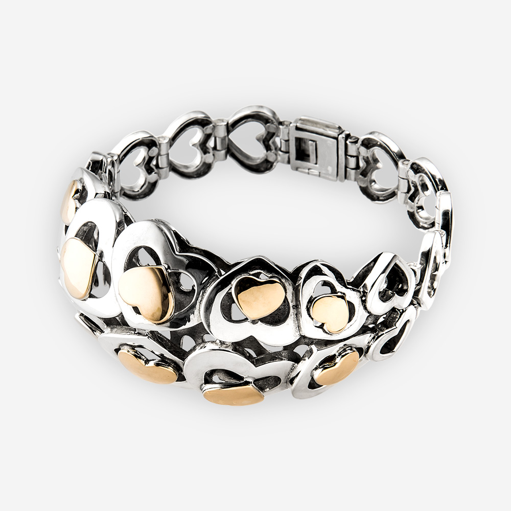 Silver and Gold Hearts Bracelet designed with different sized heart shapes in sterling silver and also gold.