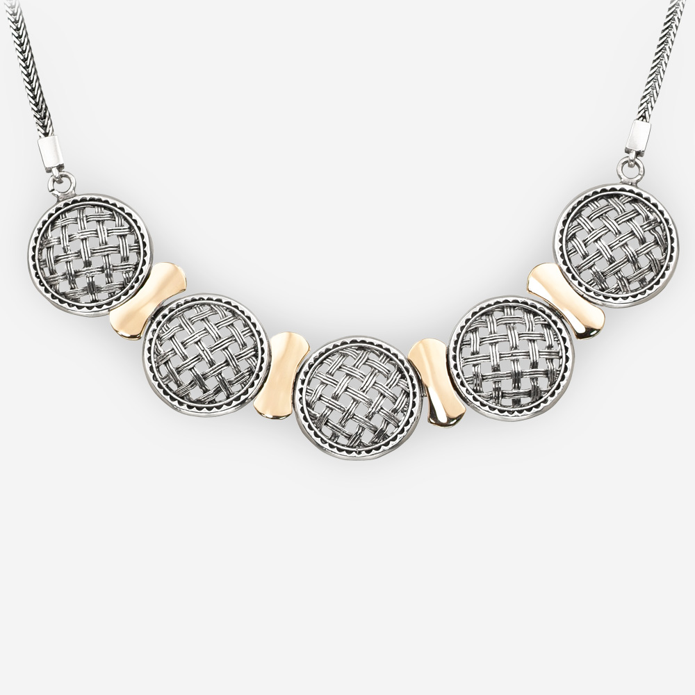 Silver lattice medallion necklace is crafted from 925 sterling silver and 14k gold on a silver chain.