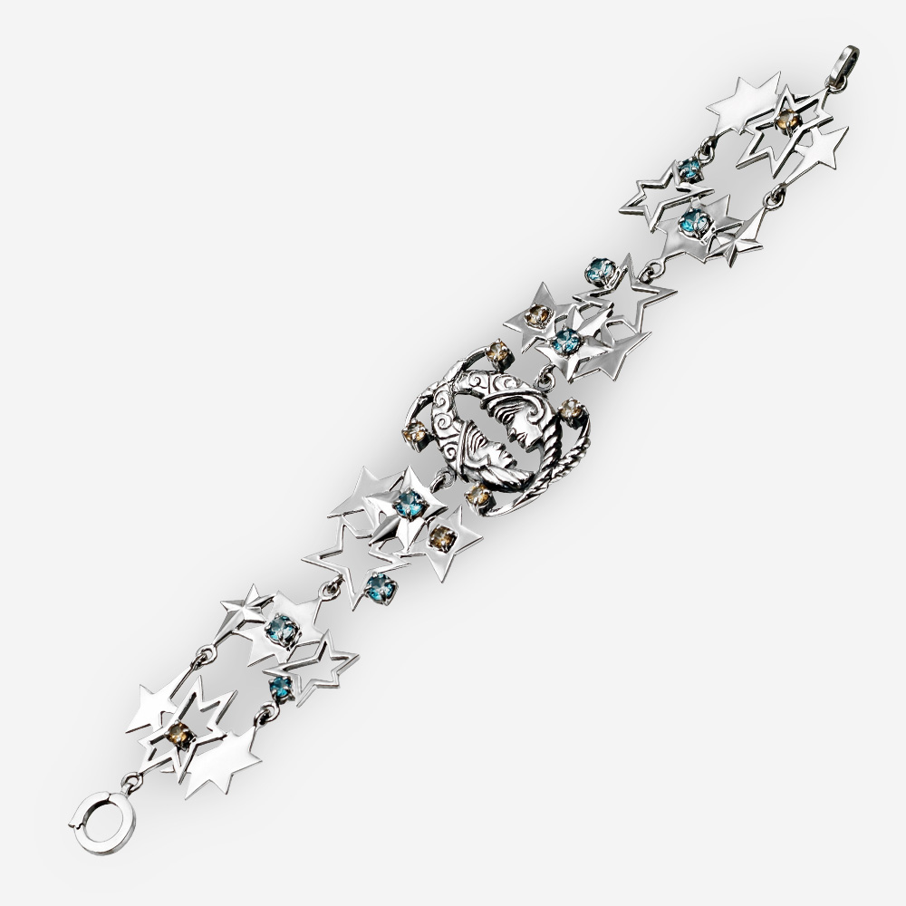 Sterling silver lunar bracelet with moon and star elements and blue topaz and citrine gemstones.