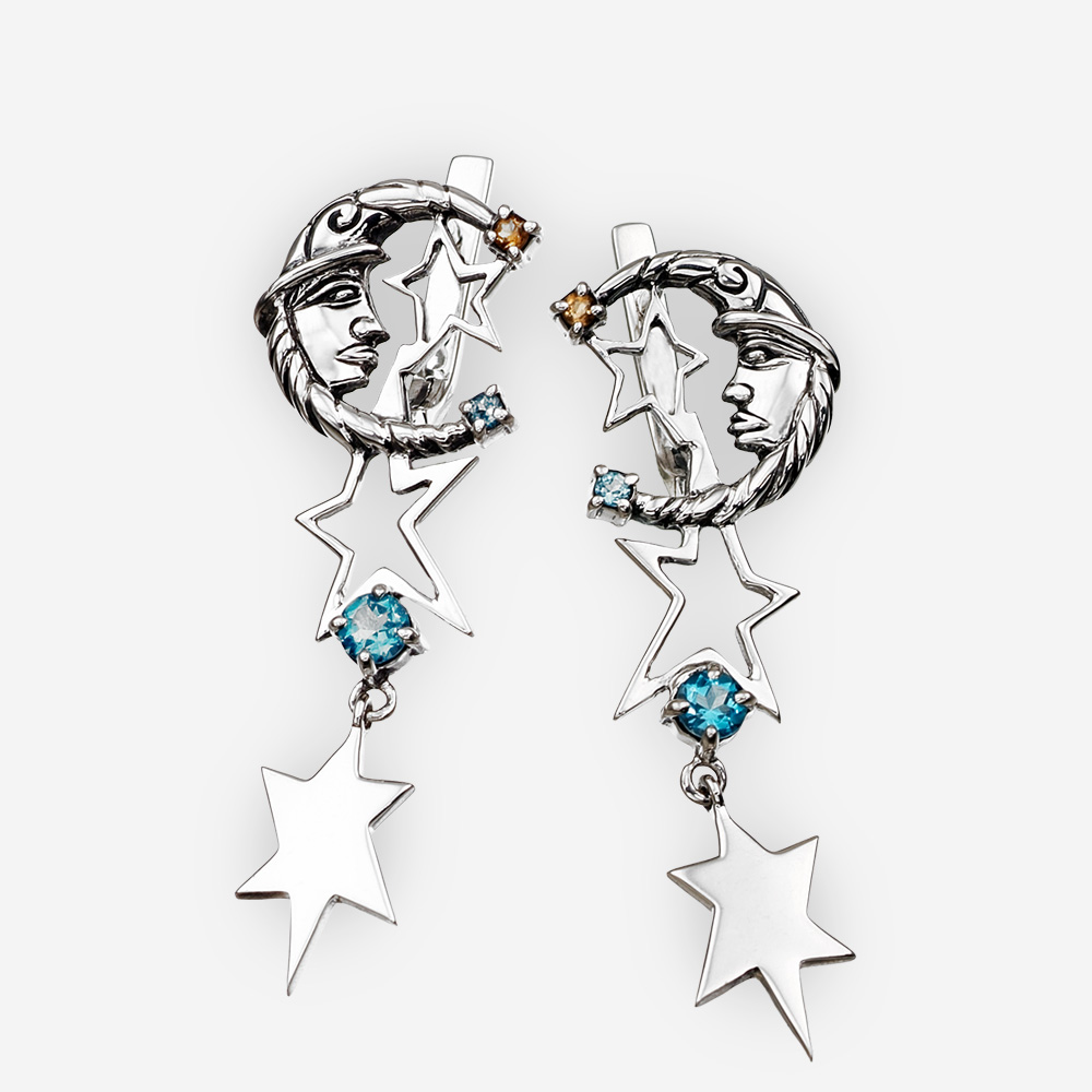 Silver lunar drop earrings with moon and star details as well as blue topaz and citrine gemstones.