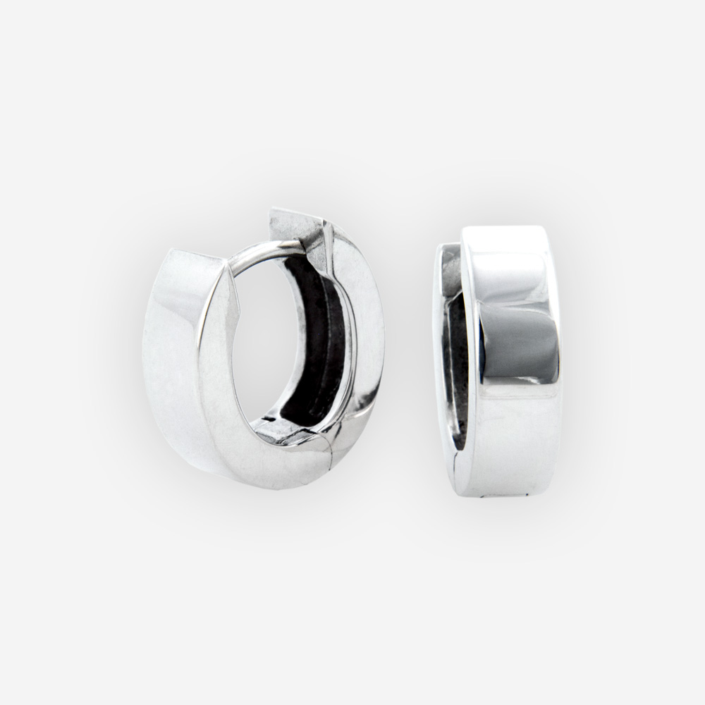 Small oval hinged hoops are crafted in 925 sterling silver with a polished finish.