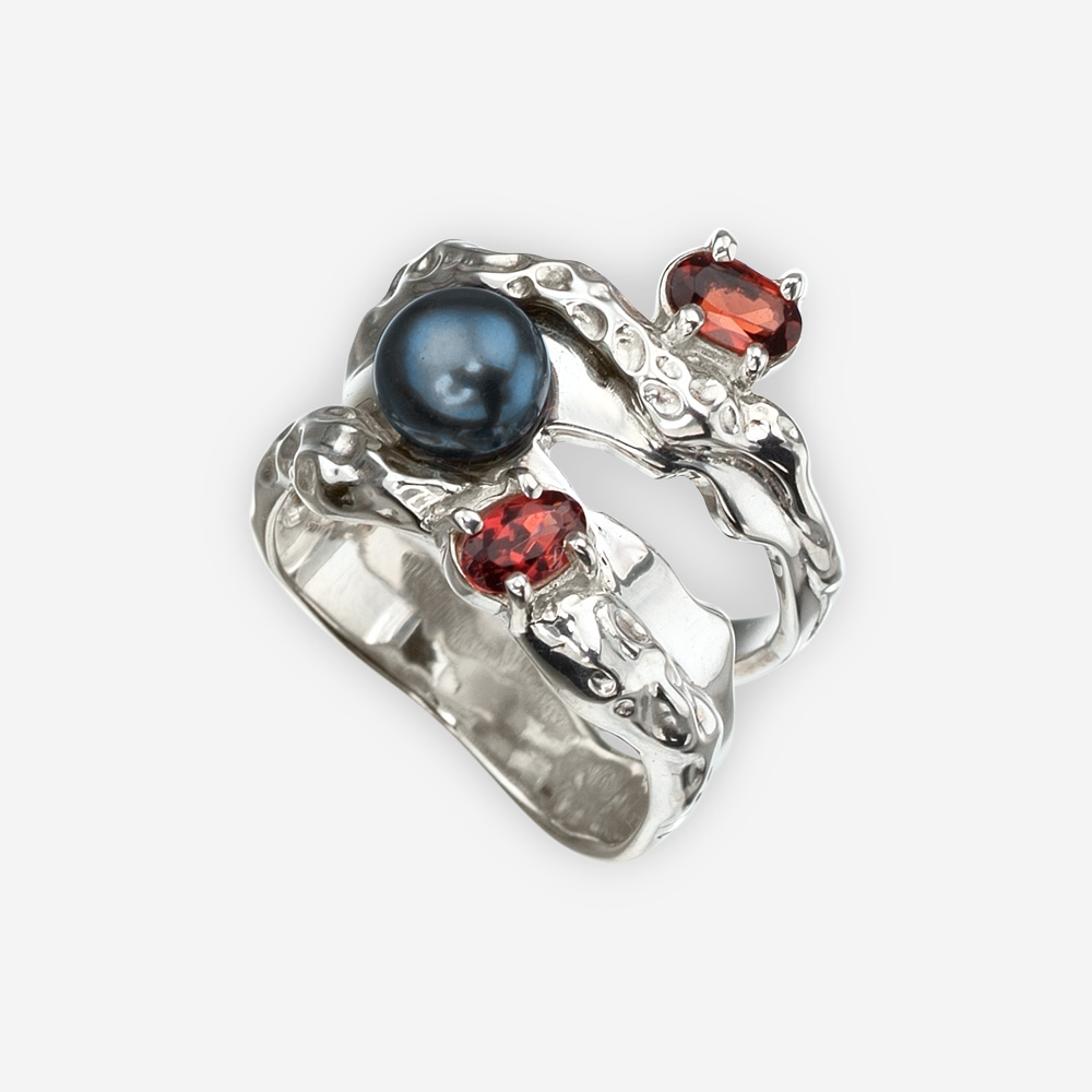 Sterling silver Art Deco ring set with a black freshwater pearl and two garnet gems.