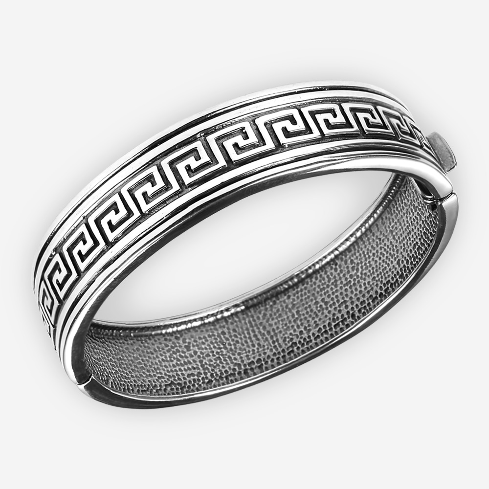 Sterling silver byzantine bangle with oxidized byzantine design and hidden closure.