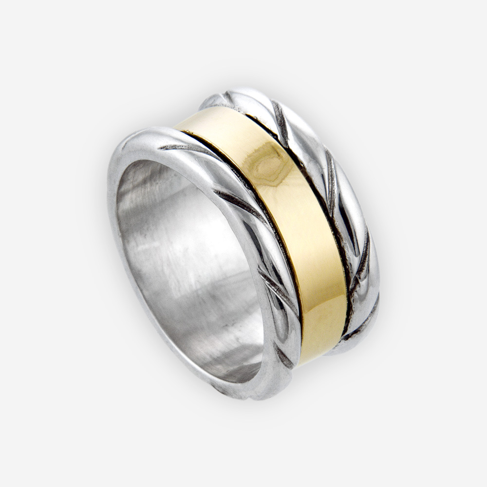 Sterling silver carved ring centered with 14k gold band.