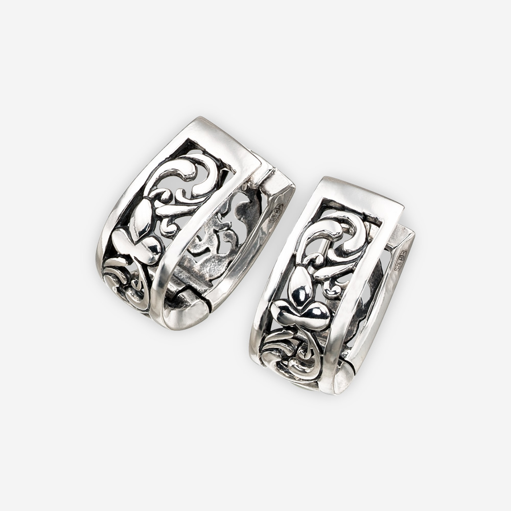 Sterling silver floral filigree earrings with a sterling silver embossed leaf accent detail.