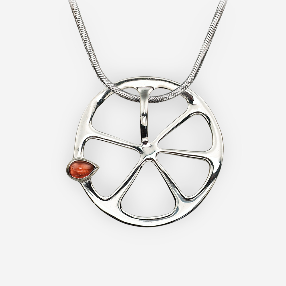 Sterling silver orange pendant with a garnet seed, crafted from 925 sterling silver.