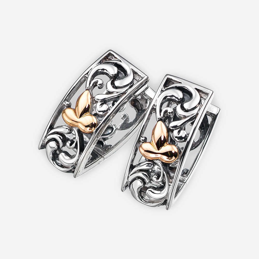 Two tone silver floral filigree earrings crafted from 925 sterling silver and 14k gold.