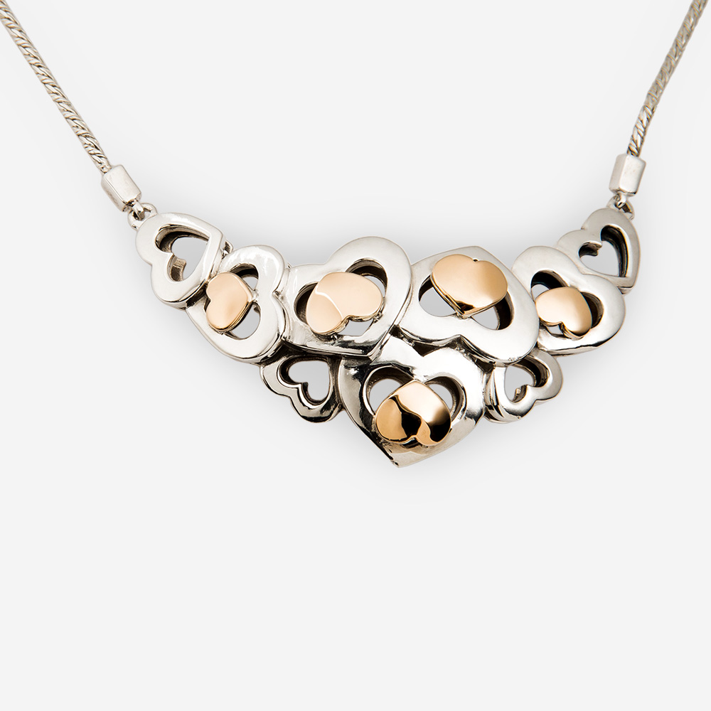 Two Tone Sterling Silver Heart Necklace with 14k Gold Hearts.