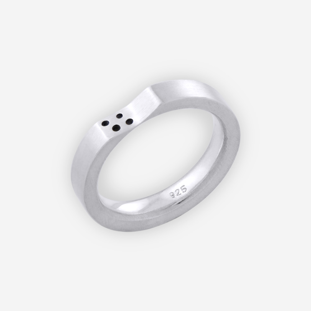 Unisex matte sterling silver band with concave upper and dot design.